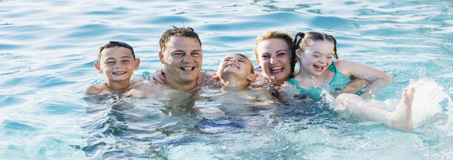 Family swimming photo